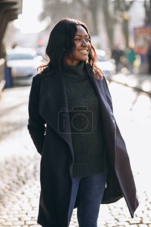 Photo for African american woman model in coat in the street - Royalty Free Image