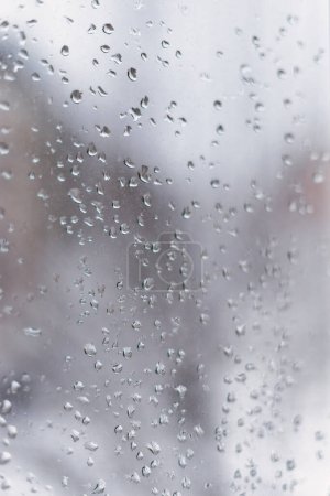 Photo for Close-up of the view from the window of the raindrops on the glass. Selective focus. Abstract. - Royalty Free Image