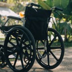 Single wheelchair parked in hospital hallway
