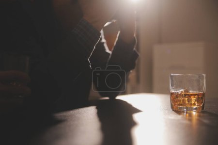 Photo for Celebration night, pour whiskey into a glass. Give to friends who come to celebrate - Royalty Free Image