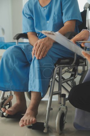 Photo for Young asian physical therapist working with senior woman on walking with a walker - Royalty Free Image