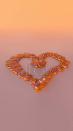 Eine zarte flüssige Karamell-Herz-Süßigkeit auf hellem Pfirsich-Hintergrund