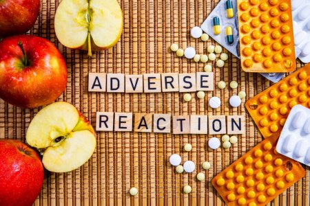 Photo for Adverse Reaction word in letters apples and medicine drugs modern medicine opioids crisis medication - Royalty Free Image