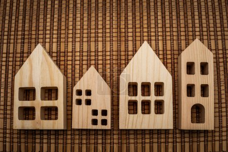 A cluster of wooden houses placed on top of a wooden table