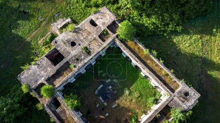 An aerial view of an old building known as the ruins of the Nazi temple Mausoleum in the forest of Walbrzych, Poland