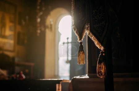 Photo for Bright sunlight streams through the windows of the Orthodox church. The concept of religion, belief in God. - Royalty Free Image