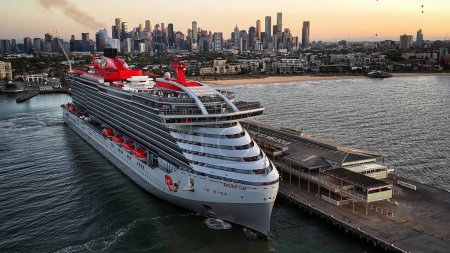 Photo for Melbourne, VIC, Australia - 23-Dec-2023 - The Resilient Lady cruise ship from Virgin Voyages arriving in Port Melbourne at sunrise - Royalty Free Image