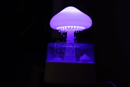Photo for Raincloud humidifier mushroom, raindrop, desktop - Royalty Free Image