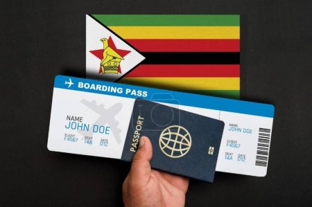 Téléchargez les photos : Passeport, carte d'embarquement et drapeau du Zimbabwe - en image libre de droit