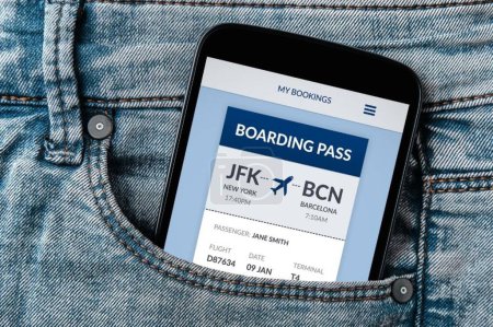 Téléchargez les photos : Concept de carte d'embarquement sur écran de smartphone en poche de jeans - en image libre de droit