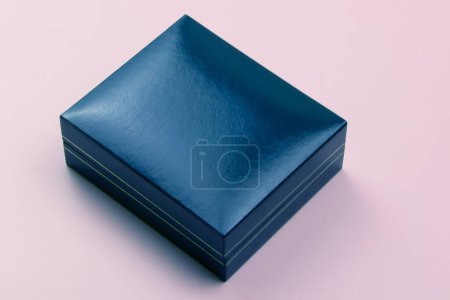  Blue gift box isolated on pink background. Top view. Flat lay.