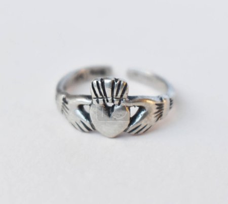 Silver ring on white background. Jewelry background. Macro shot.