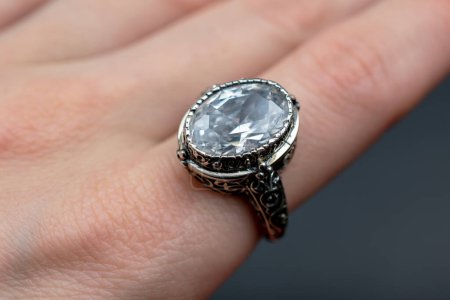Jewelry ring with diamonds on the palm of your hand.