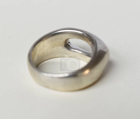 silver ring on a white background in close-up shot