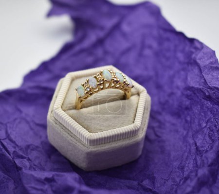 Wedding rings on a purple background. Wedding ring in a box