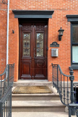 Wooden front door of a building in Boston, Massachusetts, USA.