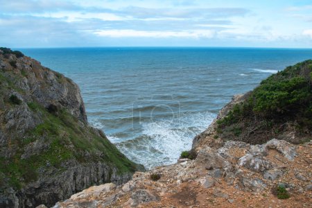 Beautiful seascape with sea, cliffs and sky with clouds