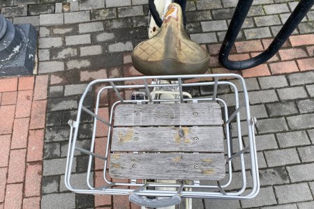 Abandoned bicycle seat on the street in Amsterdam, Netherlands.