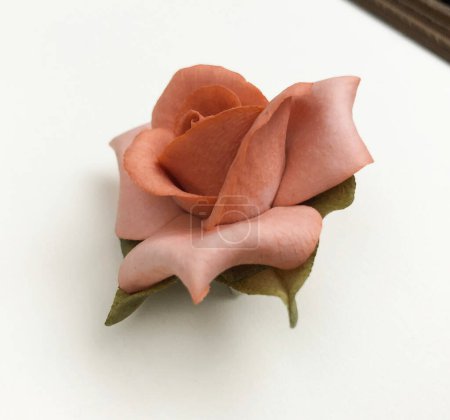Rose made of paper on white background. Clipping path included.