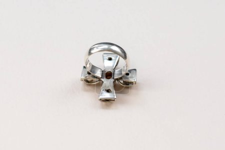 Close up of a silver ring on a white background with copy space