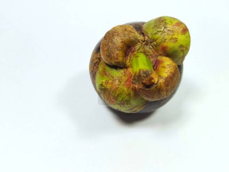Ripe mangosteen fruit top view picture, isolated on a white background.known as buah manggis in Indonesia