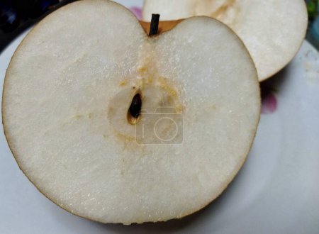 Singo Pear fruit half cut, isolated on white background