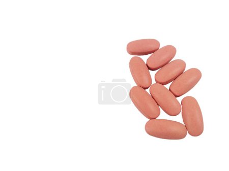 Photo for Picture of peach color tablets isolated on white background - Royalty Free Image