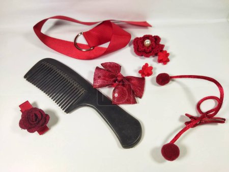 Various set of red color hair accessories isolated on white background