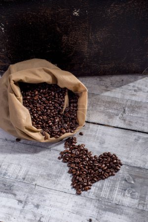 Coffee beans in a sack on wooden,retro