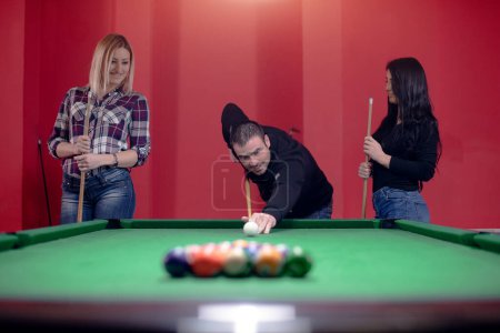 People are enjoying in game of pool