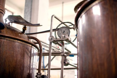 Gauge on coppler distillary vat in brewery, close up.