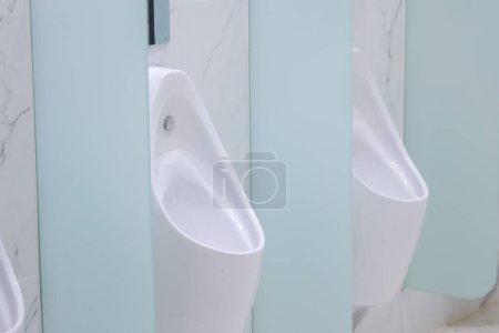 Photo for The white urinal and light through the channel. - Royalty Free Image