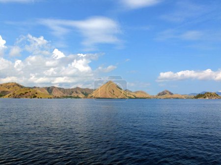 Komodo Islands Sailing Nationalpark with some clouds at the sky. High quality photo