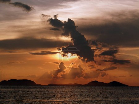 Labuan Bajo Sailing Sunset Komodo Islands National Park at dawn with sun behind clouds. High quality photo