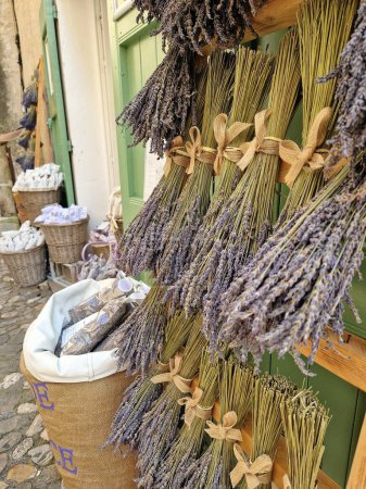 Beautiful Bunches of aromatic dried lavender of lavandin flowers for sale in a shop in France Provence. High quality photo