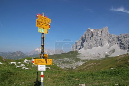 Hiking Sign to SAC Carschina Switzerland Wanderer Season Summer with little Snow. High quality photo