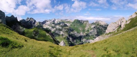Panorama Dramatic Photo of Alpstein with clouds and shadow on the mountains, switzerland, hiking season summertime. High quality photo
