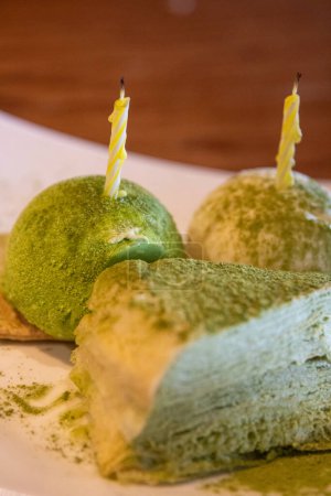 Photo for Green tea, vanilla and crepe cake for a birthday - Royalty Free Image