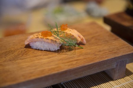 Photo for Seared salmon with dill and ikura as a garnish - Royalty Free Image