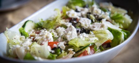 Photo for Greek salad shot very close with feta and olives - Royalty Free Image