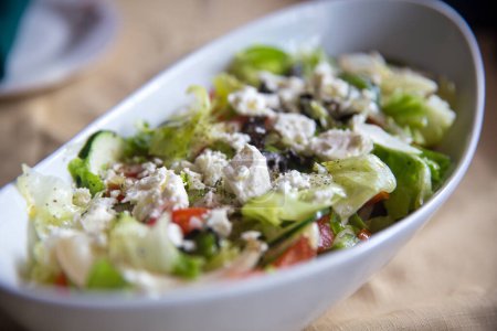 Photo for Greek salad shot very close topped off with feta - Royalty Free Image