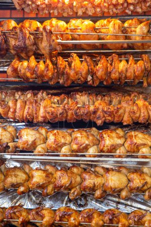 Photo for Rotisserie chicken on a rack roasting - Royalty Free Image