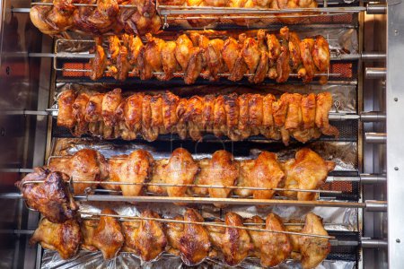 Photo for Rotisserie chicken on a rack roasting - Royalty Free Image