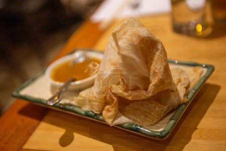 Photo for Roti Canai with Curry Sauce as an appetizer - Royalty Free Image
