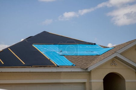 Photo for Tarped house after hurricane Ian waiting to get repaired - Royalty Free Image