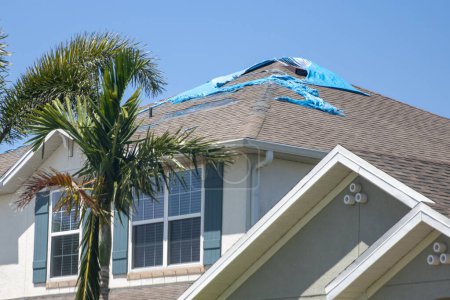 Photo for Destroyed Tarp on the roof waiting to get repaired - Royalty Free Image