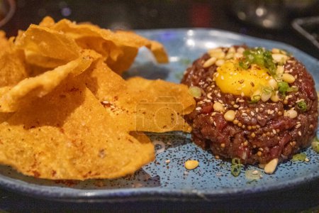 Photo for Steak tartare with Egg and chips - Royalty Free Image