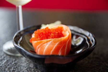 Photo for Fresh Salmon Sashimi with a glass of white wine - Royalty Free Image