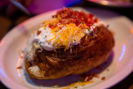 Photo for Fully loaded baked potato as a side - Royalty Free Image