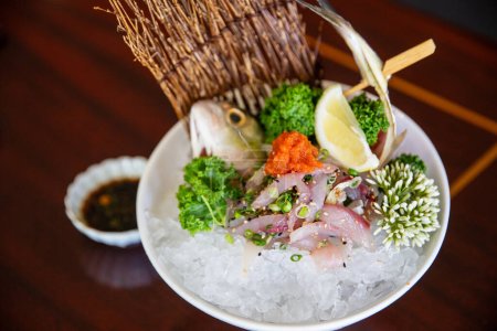 Freshly caught Aji cut sashimi style served with the body for an elegant presentation